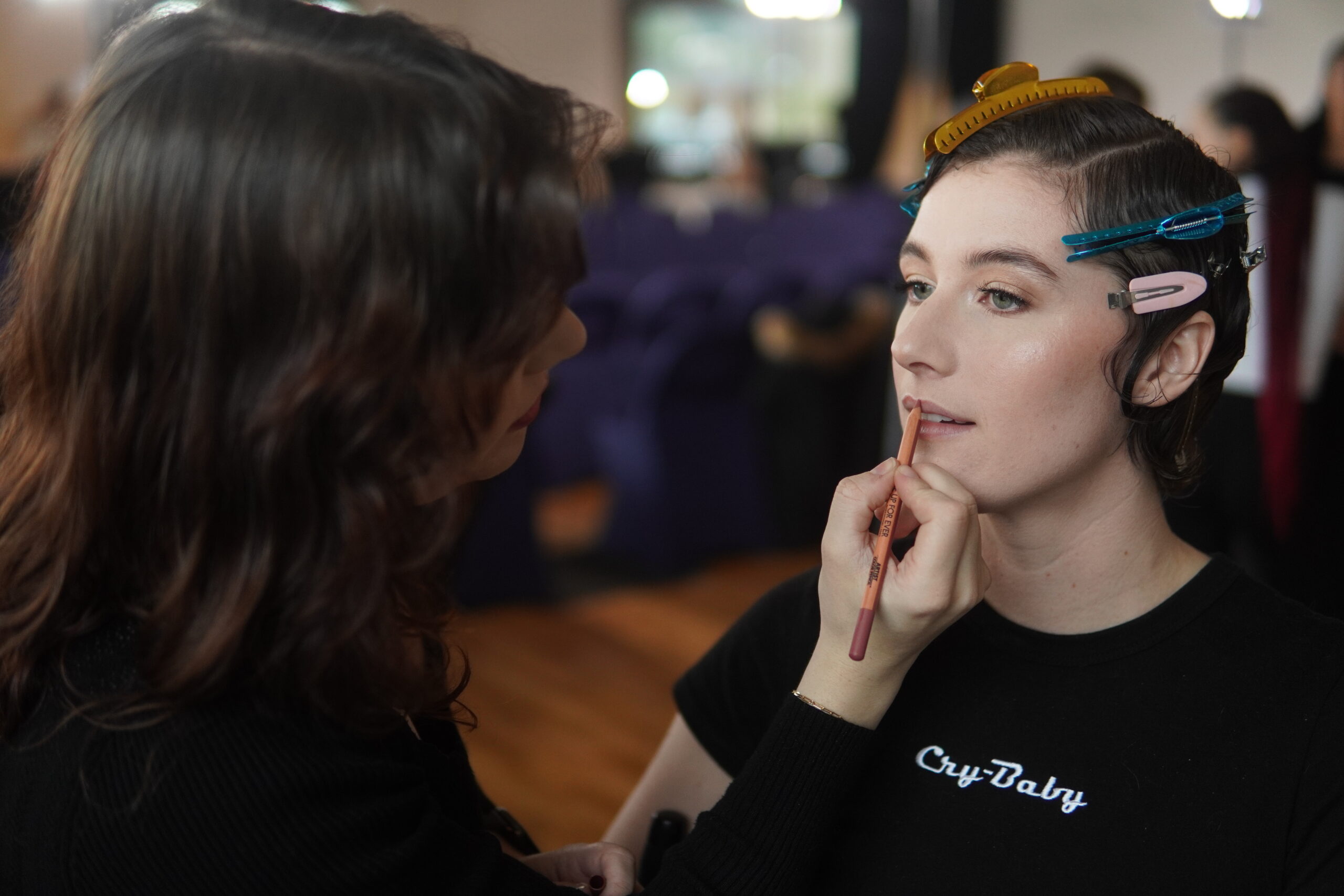 makeup application at fashion show
